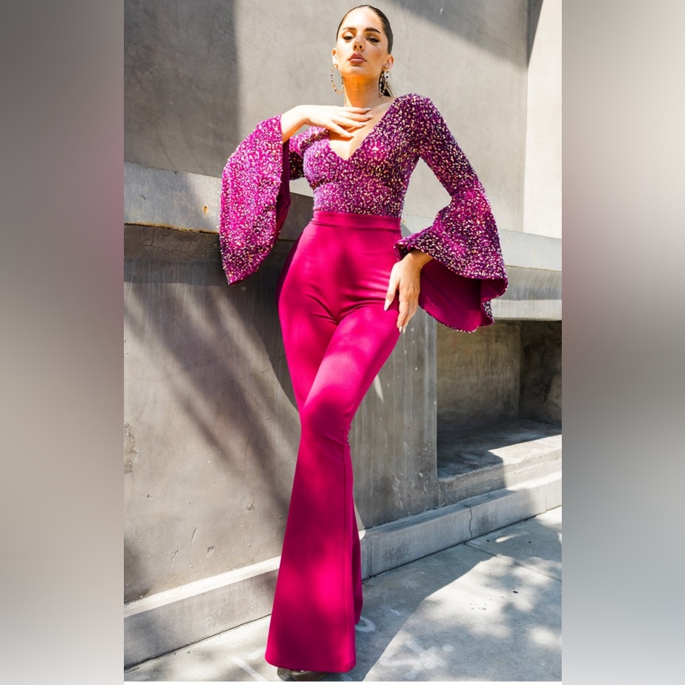 Stunning jumpsuit with beautiful sequin top, flared sleeves, flattering V-neck.
